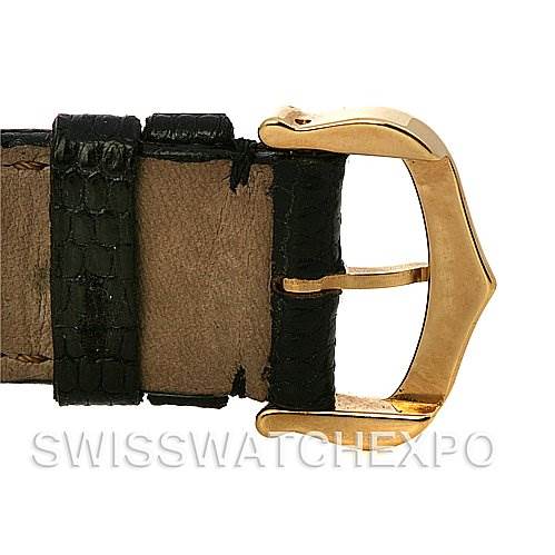 This image shows the buckle and part of the leather strap of the Cartier Santos Dumont Yellow Gold White Dial Yellow Gold White Dial watch.