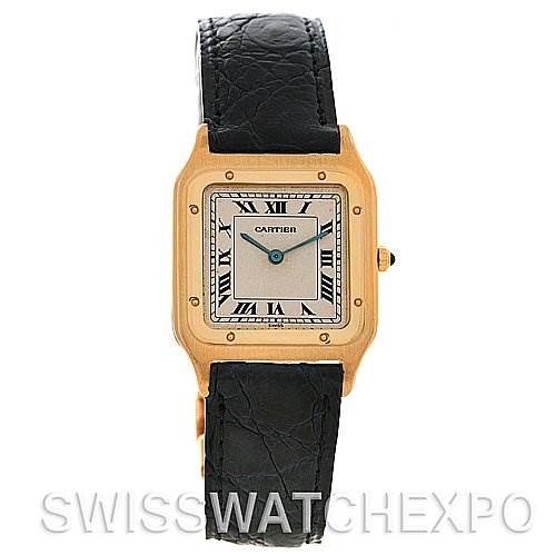 The image shows the front view of a Cartier Santos Dumont Yellow Gold White Dial Yellow Gold White Dial watch, highlighting its square dial, Roman numerals, and black leather strap.