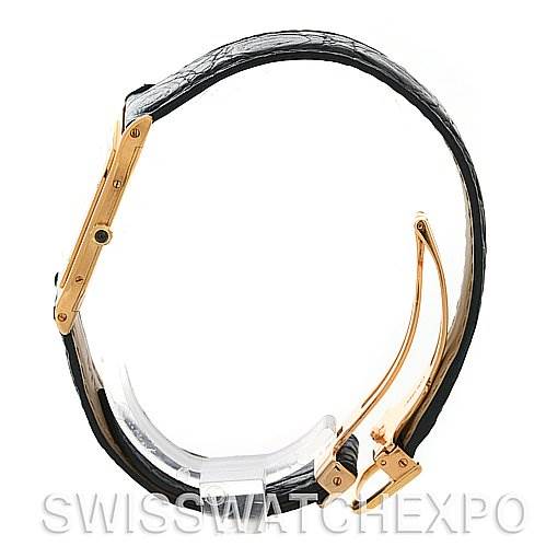 The image shows a side view of the Cartier Santos Dumont Yellow Gold White Dial Yellow Gold White Dial watch, highlighting its gold case and black leather strap.