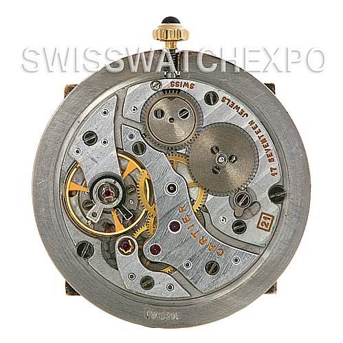 This is a close-up view of the internal mechanism of a Cartier Santos Dumont Yellow Gold White Dial Yellow Gold White Dial watch.