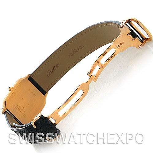 The image shows the open clasp and underside of the strap of a Cartier Santos Dumont Yellow Gold White Dial Yellow Gold White Dial watch.