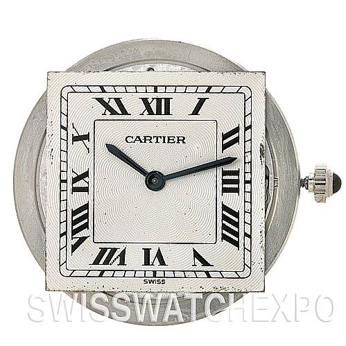 This image shows a close-up of the Cartier Santos Dumont 15751 Platinum White Dial 15751 Platinum White Dial watch face, highlighting its Roman numerals, hands, and crown.