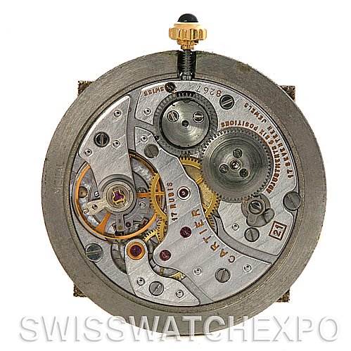 This image shows the inner mechanical movement of a Cartier Santos Dumont Yellow Gold White Dial Yellow Gold White Dial watch viewed from the back.