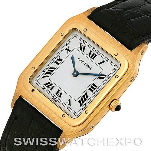 The image shows a front angle of a Cartier Santos Dumont Men's Yellow Gold White Dial Men's Yellow Gold White Dial watch, highlighting its square gold case, white dial with Roman numerals, and black leather strap.