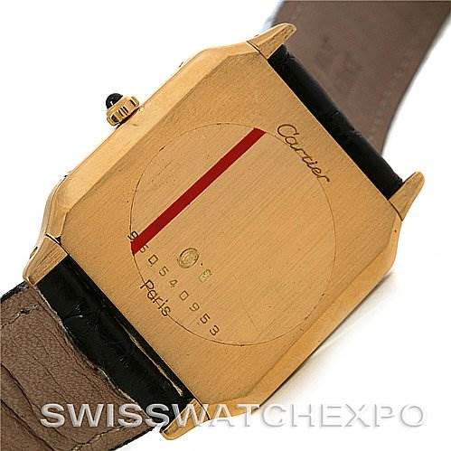 This image shows the back case of the Santos Dumont model by Cartier, highlighting the serial number and brand engraving.