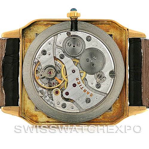 This image shows the back view of the Cartier Santos Dumont Men's Yellow Gold White Dial Men's Yellow Gold White Dial watch, revealing its internal mechanical movements.