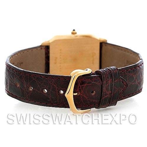 This image shows the Cartier Santos Dumont Men's Yellow Gold White Dial Men's Yellow Gold White Dial watch from the back, highlighting the case, strap, and buckle.