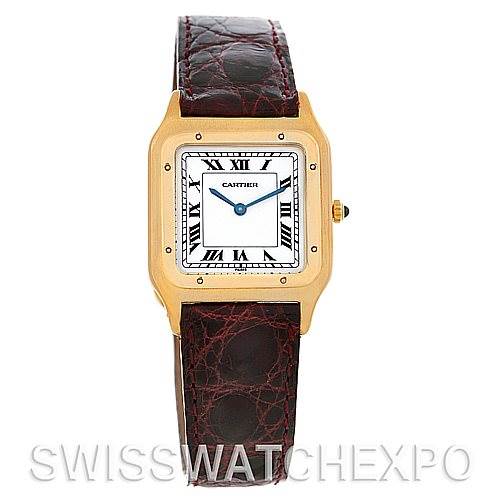 The image shows a front view of a Cartier Santos Dumont Men's Yellow Gold White Dial Men's Yellow Gold White Dial watch with a gold case, white dial, and a brown leather strap.
