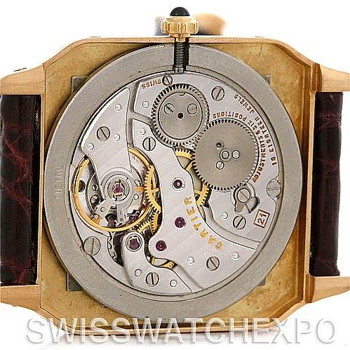 This image shows the back view of the Cartier Santos Dumont Men's Yellow Gold White Dial Men's Yellow Gold White Dial watch, highlighting its mechanical movement and internal components.
