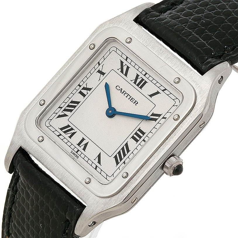 This image shows a Cartier Santos Dumont 15751 Men's Platinum White Dial 15751 Men's Platinum White Dial watch at an angled close-up, highlighting the face, bezel, crown, and strap.