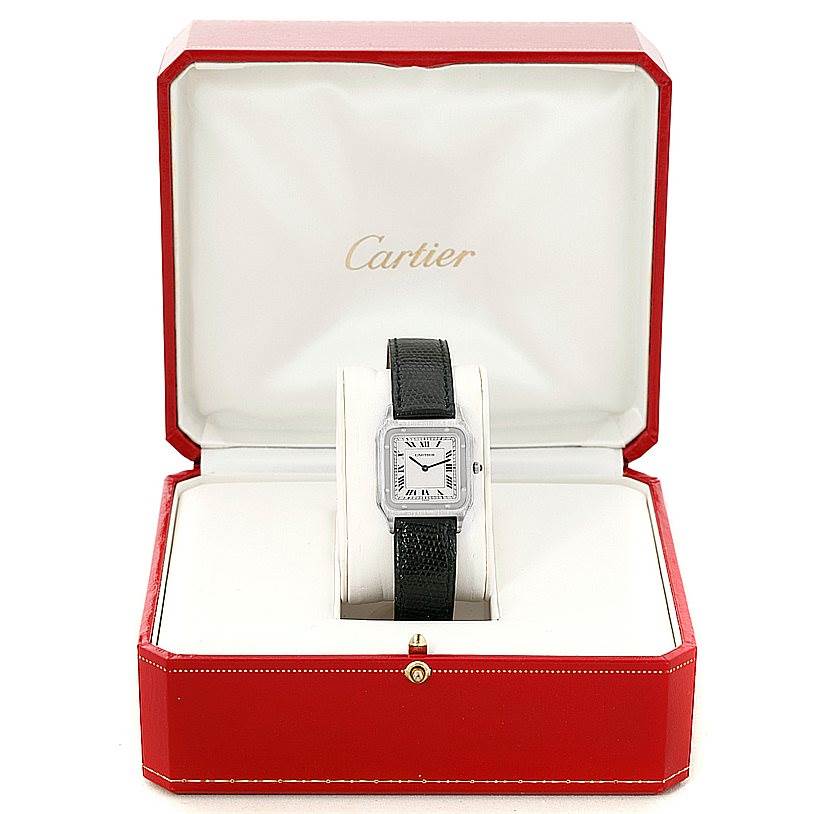 The Cartier Santos Dumont 15751 Men's Platinum White Dial 15751 Men's Platinum White Dial watch is displayed front-on in its red and white branded box.
