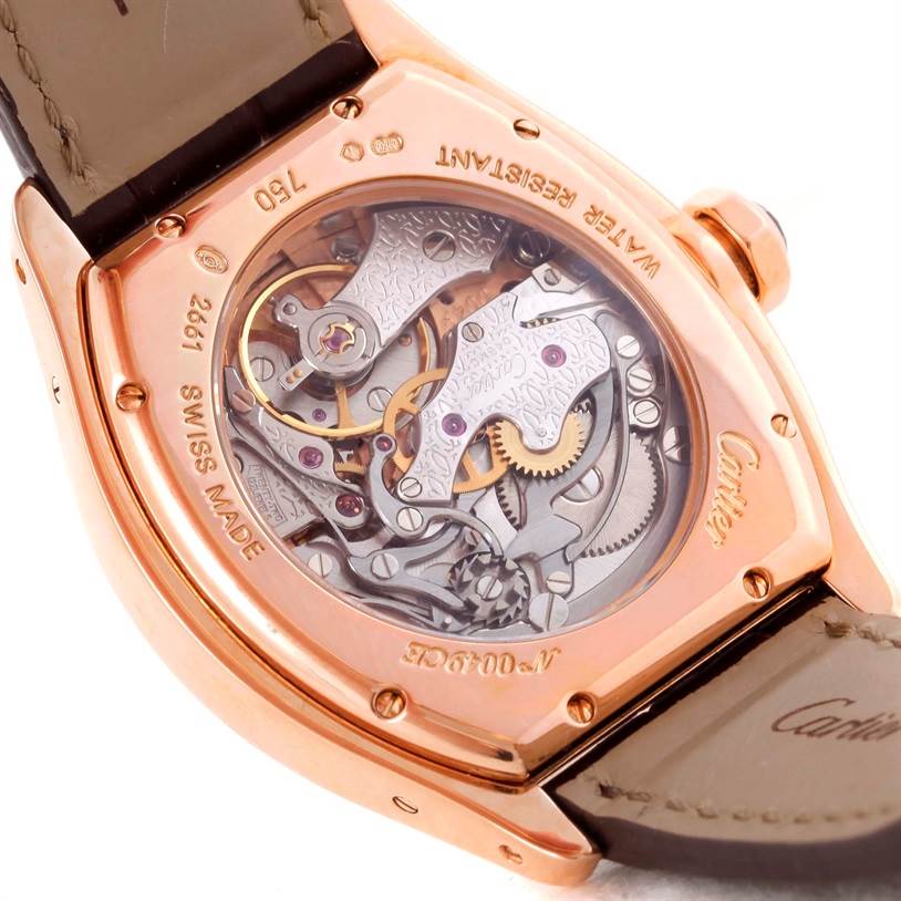 The image shows the back view of a Cartier Tortue W1543651 Men's Rose Gold Silver Dial W1543651 Men's Rose Gold Silver Dial watch, highlighting its intricate movement and mechanical parts.