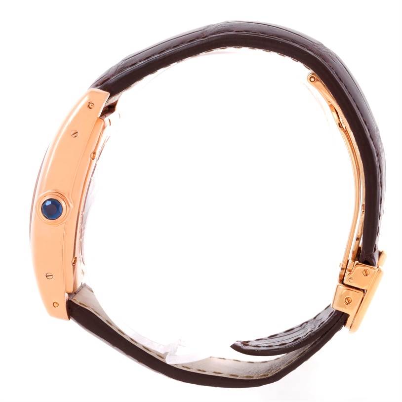 The image shows a side profile of the Cartier Tortue W1543651 Men's Rose Gold Silver Dial W1543651 Men's Rose Gold Silver Dial watch, highlighting the crown with a blue cabochon and the leather strap.