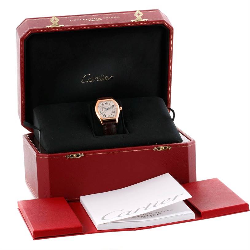 The image shows a Cartier Tortue W1543651 Men's Rose Gold Silver Dial W1543651 Men's Rose Gold Silver Dial watch in its open box, with accompanying documents.