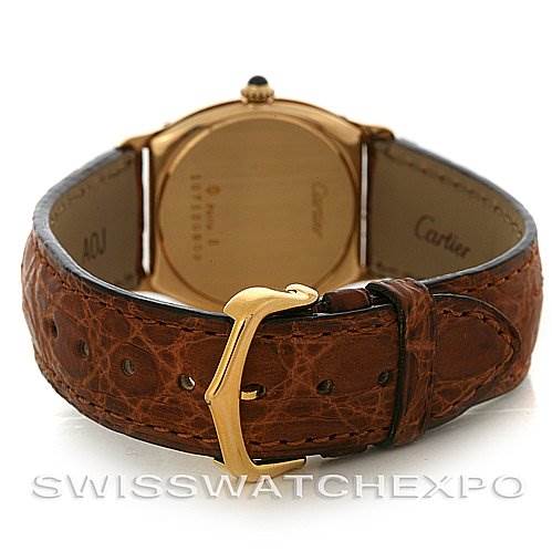 The image shows the back of the Cartier Tortue Women's Yellow Gold White Dial Women's Yellow Gold White Dial model watch and its leather strap with the buckle.