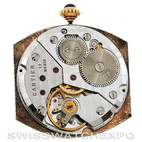 This image shows the internal movement of the Cartier Tortue Women's Yellow Gold White Dial Women's Yellow Gold White Dial watch, showcasing its gears and intricate mechanics.