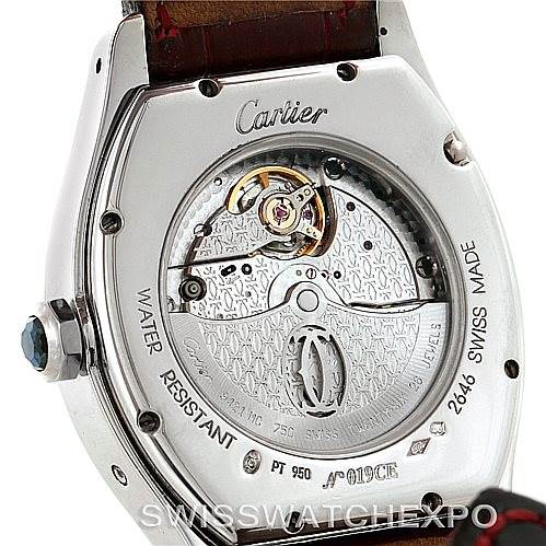 This image shows the back of a Cartier Tortue W1540551 Men's Platinum Silver Dial W1540551 Men's Platinum Silver Dial model watch revealing its internal mechanism and inscriptions.