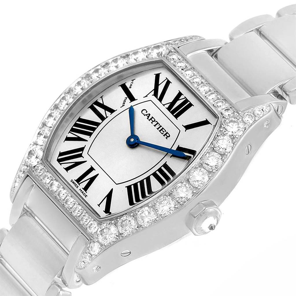 The image shows a Cartier Tortue WA5072W9 Women's White Gold Silver Dial WA5072W9 Women's White Gold Silver Dial watch at an angle highlighting the face, bezel with diamonds, and part of the bracelet.