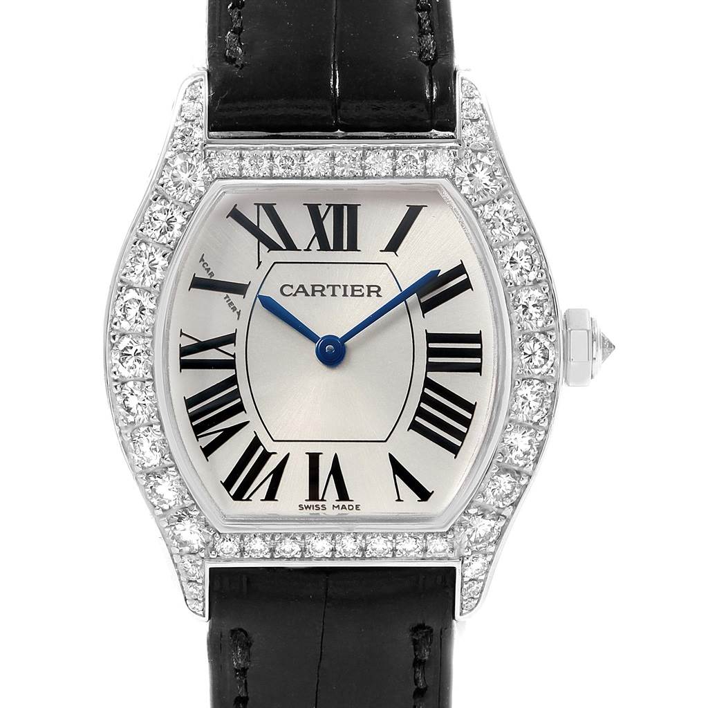 This image shows a front view of the Cartier Tortue WA507231 Women
s White Gold Silver Dial WA507231 Women
s White Gold Silver Dial watch, highlighting its diamond bezel, Roman numerals, and black leather strap.