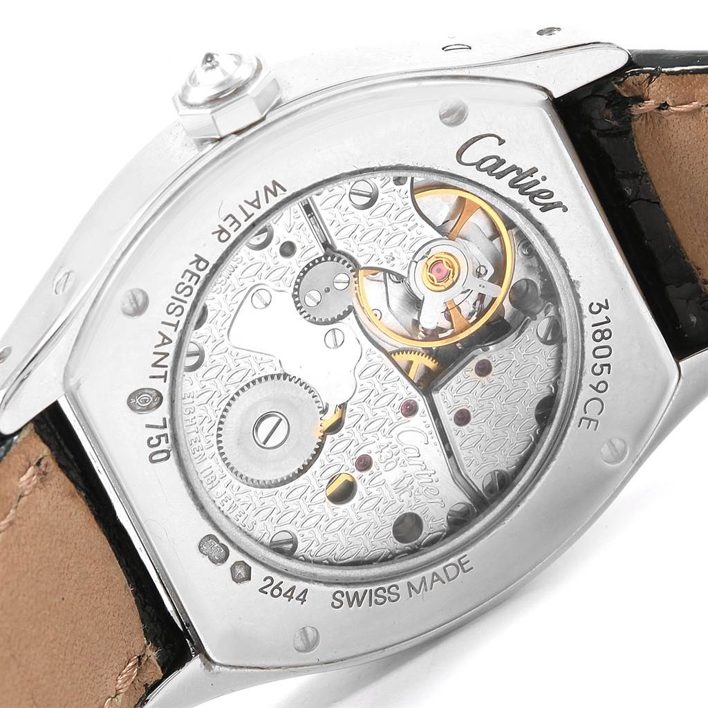 The image shows a close-up of the movement mechanism of a Cartier Tortue WA507231 Women
s White Gold Silver Dial WA507231 Women
s White Gold Silver Dial watch, viewed from the back.