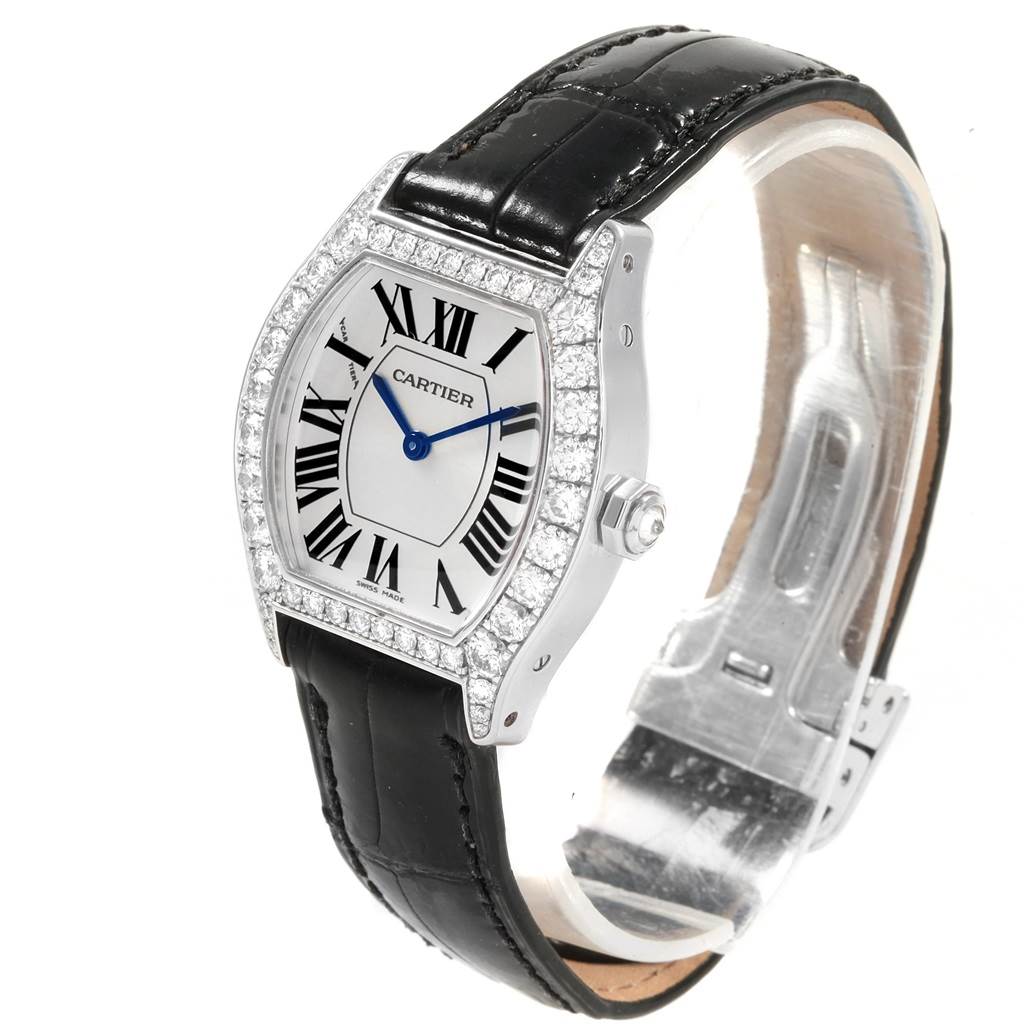 The image shows a Cartier Tortue WA507231 Women
s White Gold Silver Dial WA507231 Women
s White Gold Silver Dial watch from a front-left angle, highlighting its face, bezel, and black leather strap.