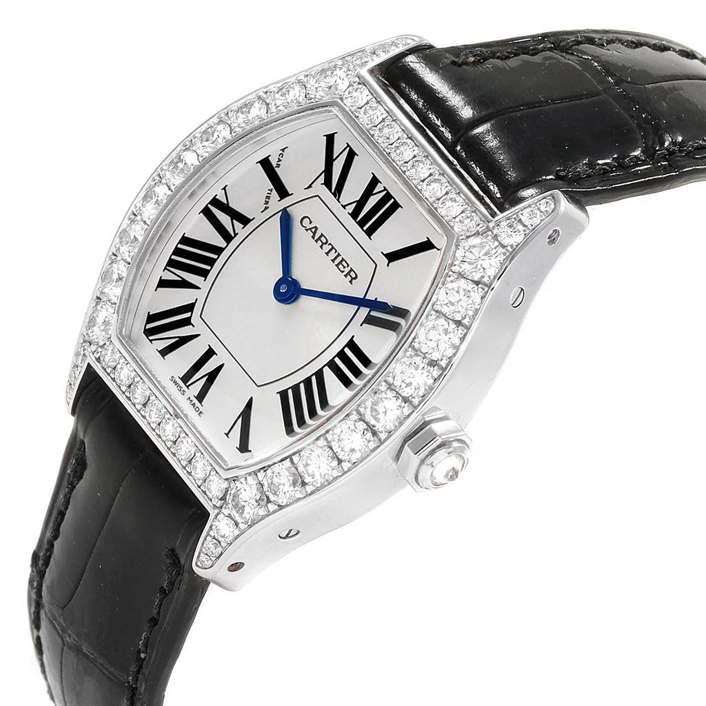 The image shows a Cartier Tortue WA507231 Women
s White Gold Silver Dial WA507231 Women
s White Gold Silver Dial watch from an angled side view showcasing its face, bezel, and crown.