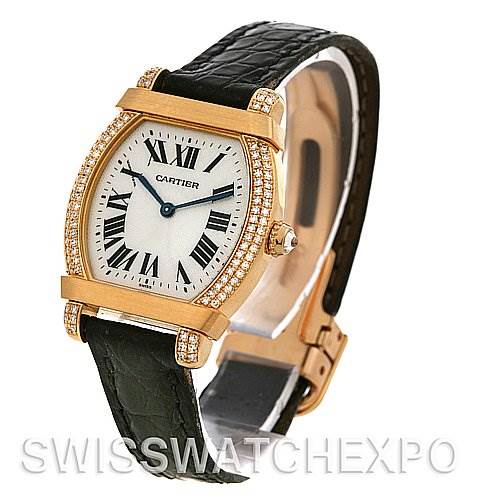 The Cartier Tortue Women
s Yellow Gold Silver Dial Women
s Yellow Gold Silver Dial watch is shown at a left-side angle, displaying the face, bezel, case, and strap.