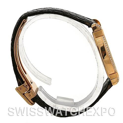 This image shows a side view of a Cartier Tortue Women
s Yellow Gold Silver Dial Women
s Yellow Gold Silver Dial watch, highlighting the watch case and part of the leather strap.