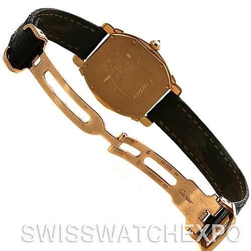 The image shows the back and clasp of a Cartier Tortue Women
s Yellow Gold Silver Dial Women
s Yellow Gold Silver Dial model watch, highlighting the case back and leather strap with a deployment buckle.