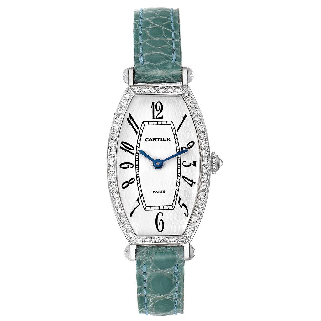 The image shows a face-on view of a Cartier Tortue WE400131 Women's White Gold White Dial WE400131 Women's White Gold White Dial model watch with a green strap and diamond-encrusted bezel.
