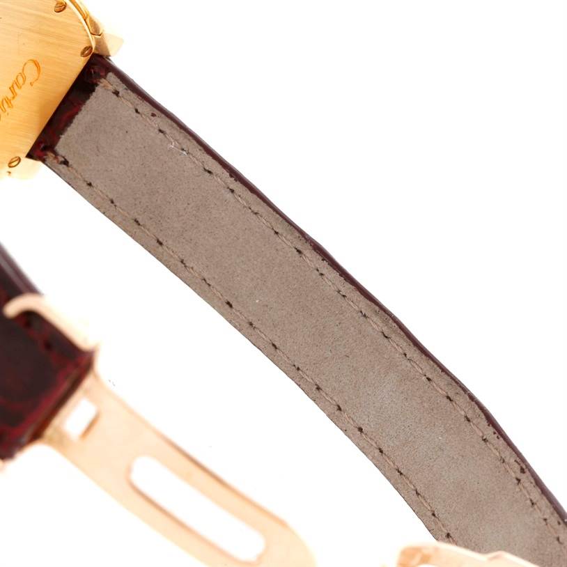 This image shows the backside of the leather strap and partial buckle of a Cartier Tortue Women's Yellow Gold Champagne Dial Women's Yellow Gold Champagne Dial watch.