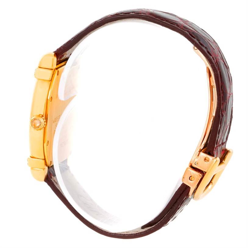 The watch is shown from a side profile, featuring the case, crown, strap, and buckle of the Cartier Tortue Women's Yellow Gold Champagne Dial Women's Yellow Gold Champagne Dial model.