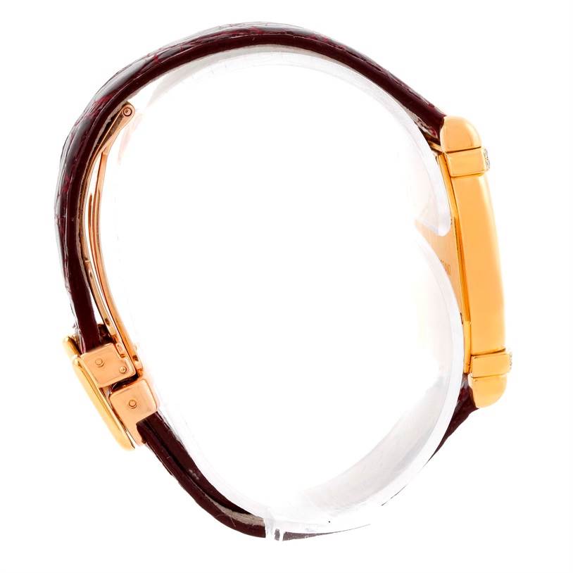 The image shows a side view of a Tortue model watch by Cartier, highlighting the case, crown, and strap.