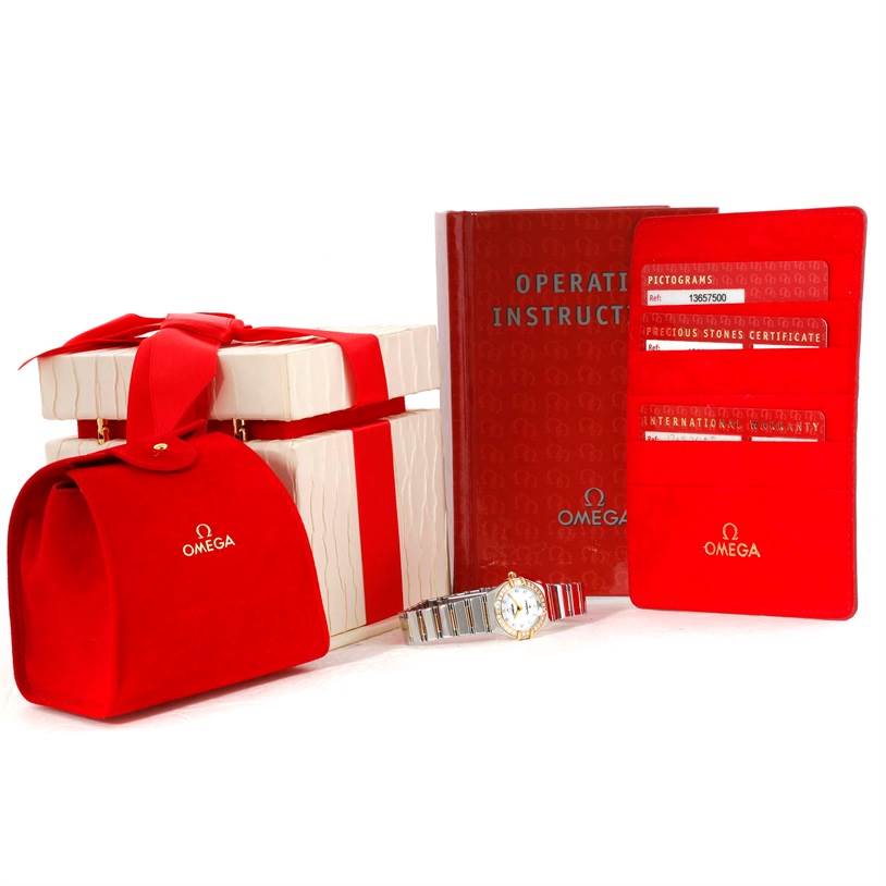 The image shows the Omega 1365.75.00 Women
s Steel and Gold (two tone) Mother of Pearl Dial 1365.75.00 Women
s Steel and Gold (two tone) Mother of Pearl Dial Constellation Mini Steel Yellow Gold Diamond Watch 1365.75.00 with its box, manual, certificates, and a red pouch.