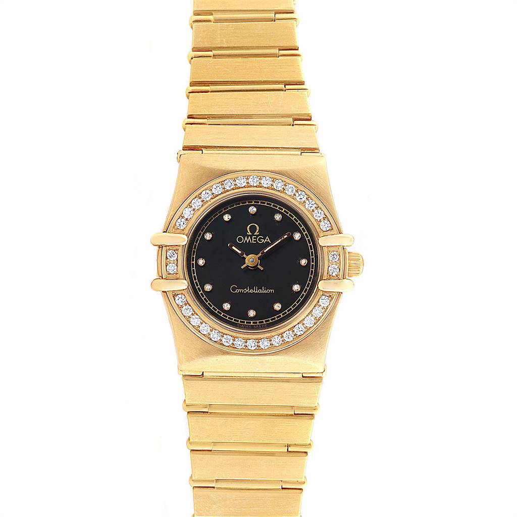 The Omega 1164.75.00 Women's Yellow Gold Black Dial 1164.75.00 Women's Yellow Gold Black Dial Constellation 18K Yellow Gold Diamond Ladies Watch 1164.75.00 is shown from a front angle, displaying the face, bezel, and part of the bracelet.