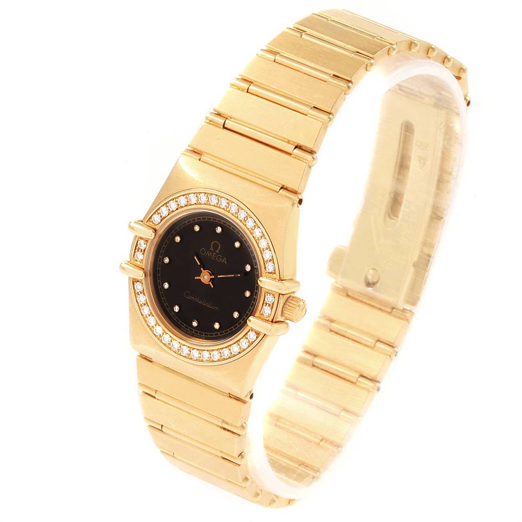The Omega 1164.75.00 Women's Yellow Gold Black Dial 1164.75.00 Women's Yellow Gold Black Dial Constellation 18K Yellow Gold Diamond Ladies Watch 1164.75.00 is shown from an angled perspective, displaying both the face and bracelet.