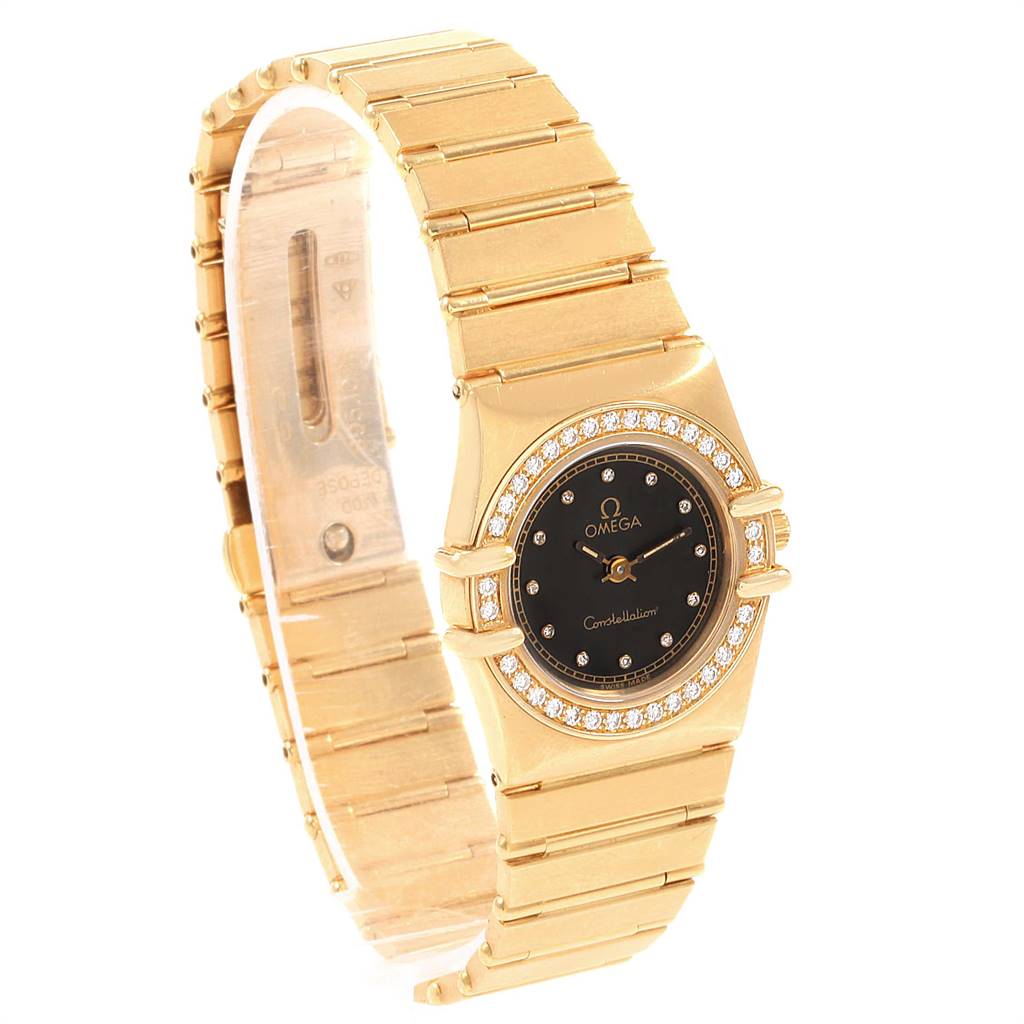 The Omega 1164.75.00 Women's Yellow Gold Black Dial 1164.75.00 Women's Yellow Gold Black Dial Constellation 18K Yellow Gold Diamond Ladies Watch 1164.75.00 is shown at an angled view highlighting the band and face.