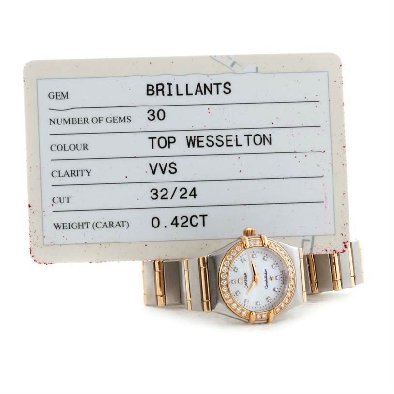 The image shows an Omega 1267.75.00 Women
s Steel and Gold (two tone) Mother of Pearl Dial 1267.75.00 Women
s Steel and Gold (two tone) Mother of Pearl Dial Constellation My Choice Mini Diamond Watch 1267.75.00, viewed from the front with its certification card.