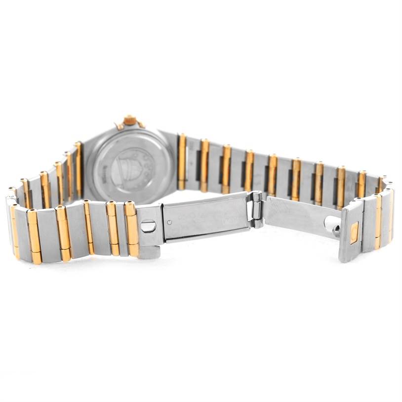 The image shows the back and partially opened clasp of an Omega 1267.75.00 Women
s Steel and Gold (two tone) Mother of Pearl Dial 1267.75.00 Women
s Steel and Gold (two tone) Mother of Pearl Dial Constellation My Choice Mini Diamond Watch 1267.75.00.