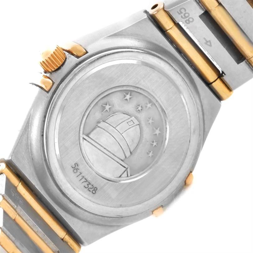 The image shows the back case and part of the bracelet of the Omega 1267.75.00 Women
s Steel and Gold (two tone) Mother of Pearl Dial 1267.75.00 Women
s Steel and Gold (two tone) Mother of Pearl Dial Constellation My Choice Mini Diamond Watch 1267.75.00.