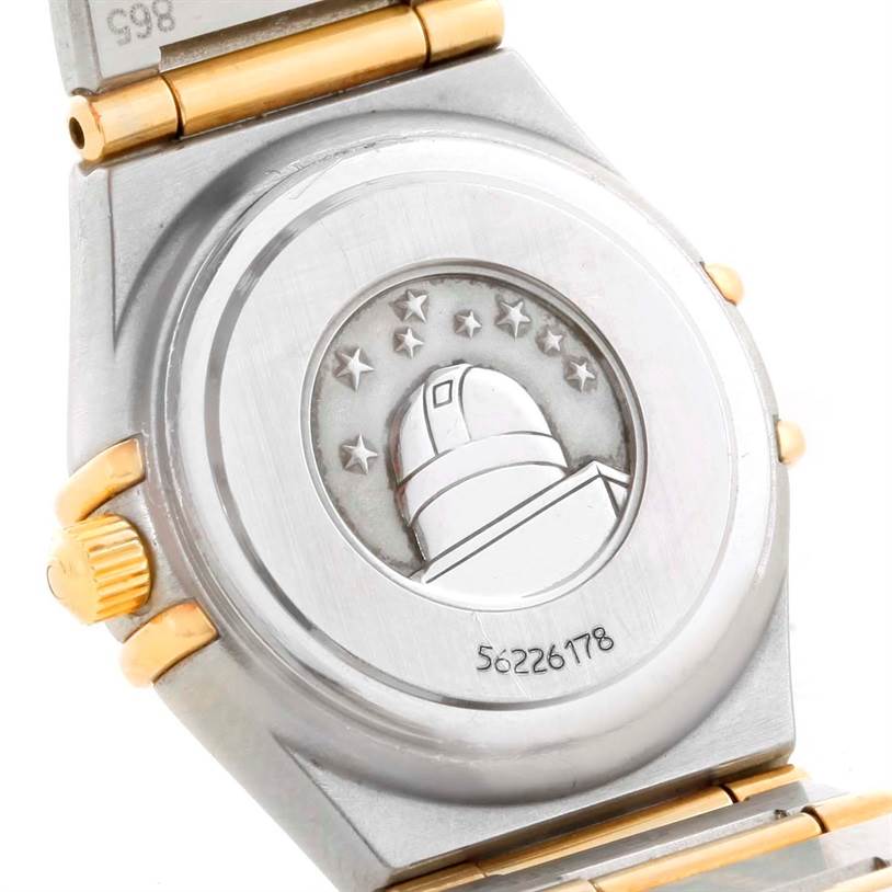 The image shows the back case of the Omega 1267.75.00 Women
s Steel and Gold (two tone) Mother of Pearl Dial 1267.75.00 Women
s Steel and Gold (two tone) Mother of Pearl Dial Constellation My Choice Mini Two Tone Diamond Watch 1267.75.00.