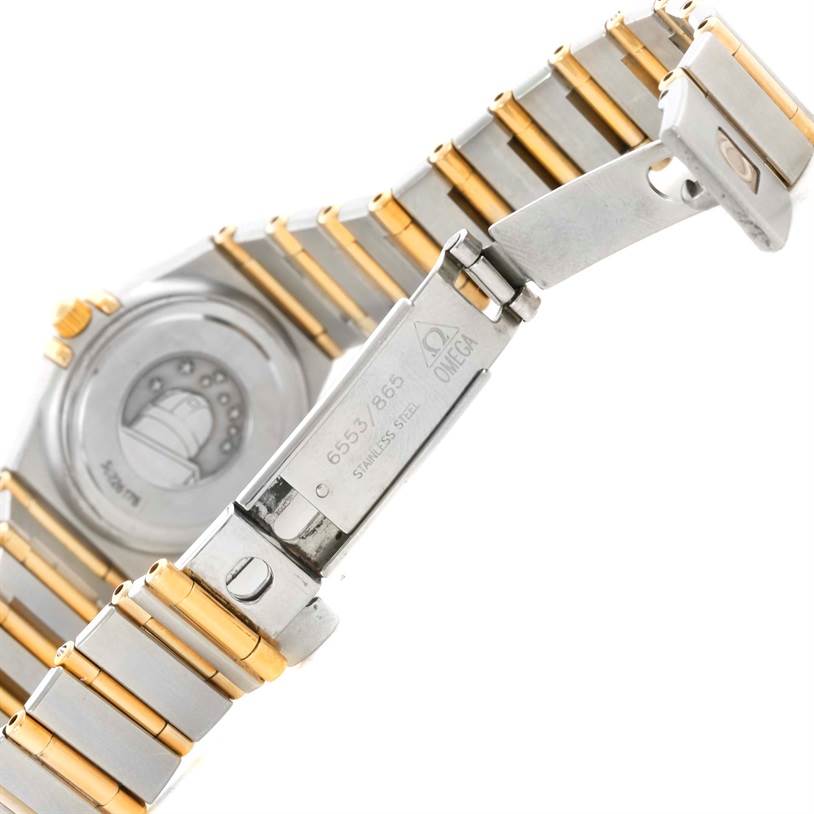 The image shows the clasp and part of the bracelet of an Omega 1267.75.00 Women
s Steel and Gold (two tone) Mother of Pearl Dial 1267.75.00 Women
s Steel and Gold (two tone) Mother of Pearl Dial Constellation My Choice Mini Two Tone Diamond Watch 1267.75.00.