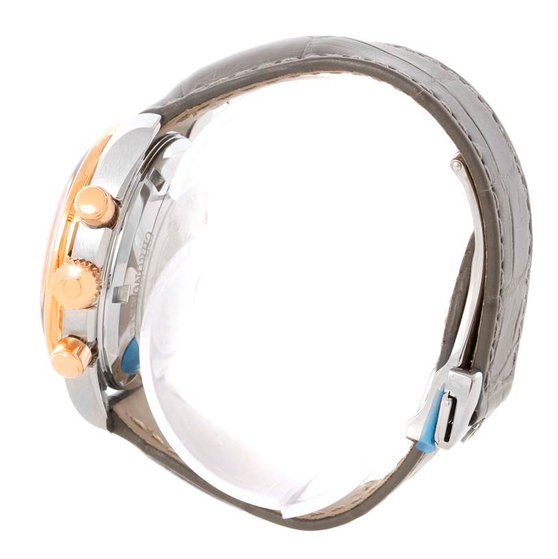 The image shows a side view of the Omega 324.28.38.40.06.001 Men's Steel and Gold (two tone) Grey Dial 324.28.38.40.06.001 Men's Steel and Gold (two tone) Grey Dial Speedmaster Chronograph Diamond Watch 324.28.38.40.06.001, highlighting the crown, pushers, and strap.