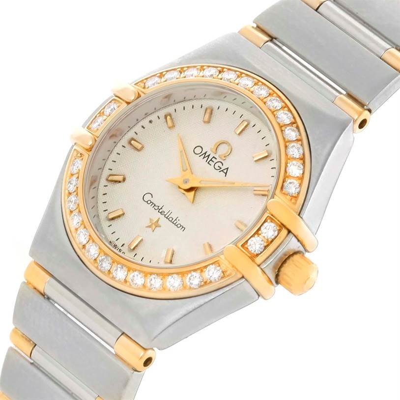 The Omega 1277.30.00 Women's Steel and Gold (two tone) Silver Dial 1277.30.00 Women's Steel and Gold (two tone) Silver Dial Constellation Mini Steel and Gold Textured Dial Diamond Watch 1277.30.00 is shown at an angled close-up of the face and bracelet.