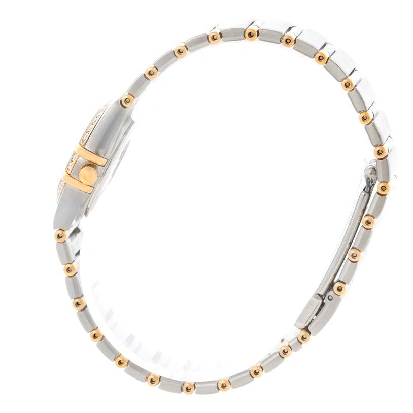 The Omega 1277.30.00 Women's Steel and Gold (two tone) Silver Dial 1277.30.00 Women's Steel and Gold (two tone) Silver Dial Constellation Mini 1277.30.00 watch is shown from a side angle, highlighting its steel and gold bracelet and diamond-accented case.