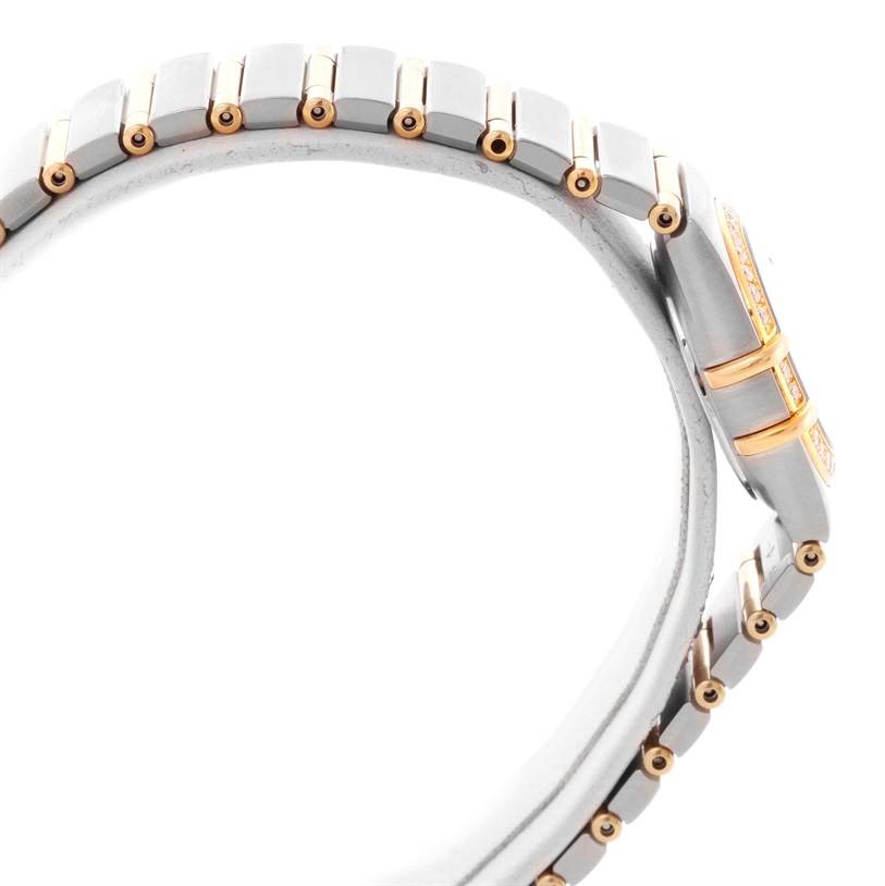 The image shows a side view of an Omega 1267.70.00 Women
s Steel and Gold (two tone) Mother of Pearl Dial 1267.70.00 Women
s Steel and Gold (two tone) Mother of Pearl Dial Constellation My Choice Mini Steel Gold Diamond Watch 1267.70.00, highlighting its band and case.