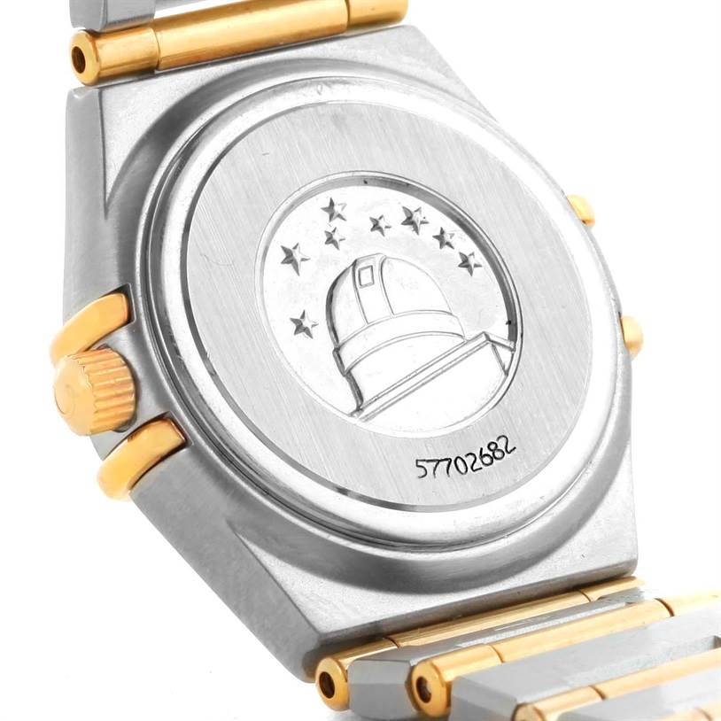 This image shows the case back and part of the bracelet of the Omega 1267.70.00 Women
s Steel and Gold (two tone) Mother of Pearl Dial 1267.70.00 Women
s Steel and Gold (two tone) Mother of Pearl Dial Constellation My Choice Mini Steel Gold Diamond Watch 1267.70.00.