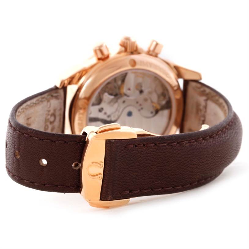 The image shows the back of the Omega 4677.60.37 Women's Rose Gold Mother of Pearl Dial 4677.60.37 Women's Rose Gold Mother of Pearl Dial DeVille Co-Axial 18K Rose Gold Diamond Ladies Watch model 4677.60.37 and its brown leather strap.