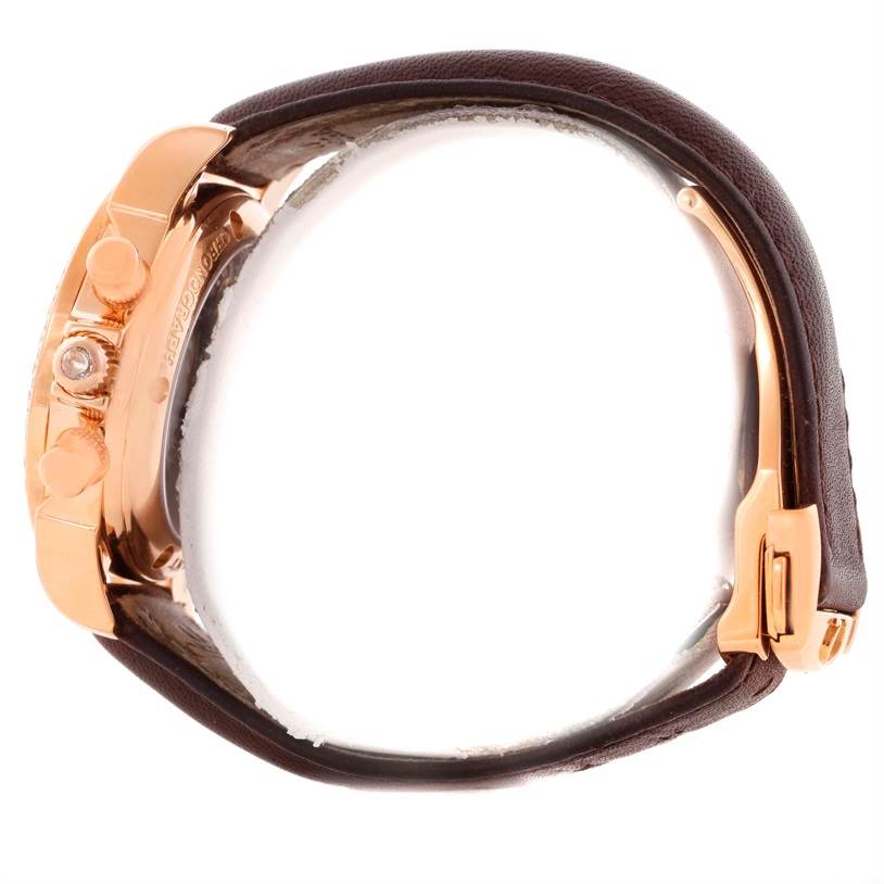 Side view of the Omega 4677.60.37 Women's Rose Gold Mother of Pearl Dial 4677.60.37 Women's Rose Gold Mother of Pearl Dial DeVille Co-Axial 18K Rose Gold Diamond Ladies Watch 4677.60.37 showing the crown, pushers, and part of the strap.