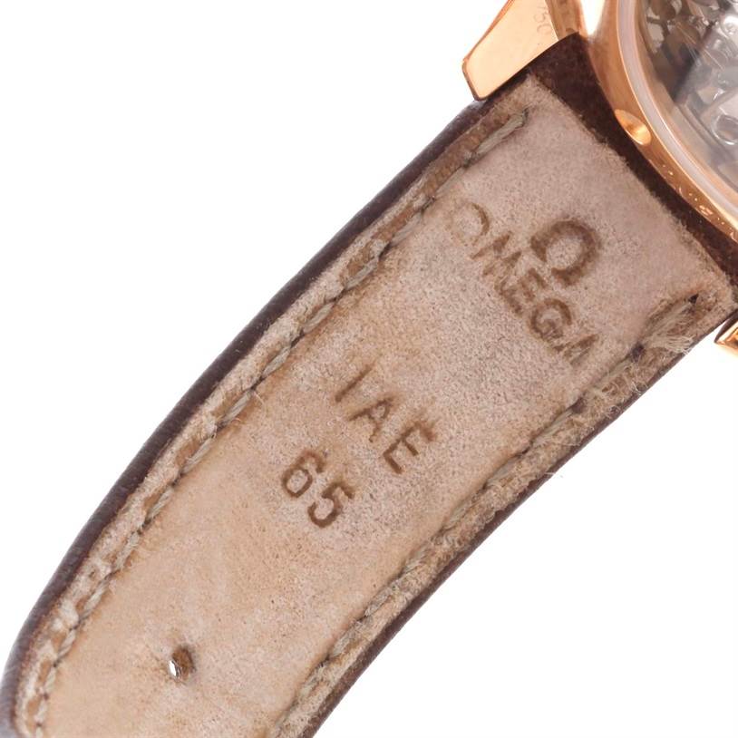 The image shows a close-up of the strap and part of the case of an Omega 4677.60.37 Women's Rose Gold Mother of Pearl Dial 4677.60.37 Women's Rose Gold Mother of Pearl Dial DeVille Co-Axial 18K Rose Gold Diamond Ladies Watch 4677.60.37 model.